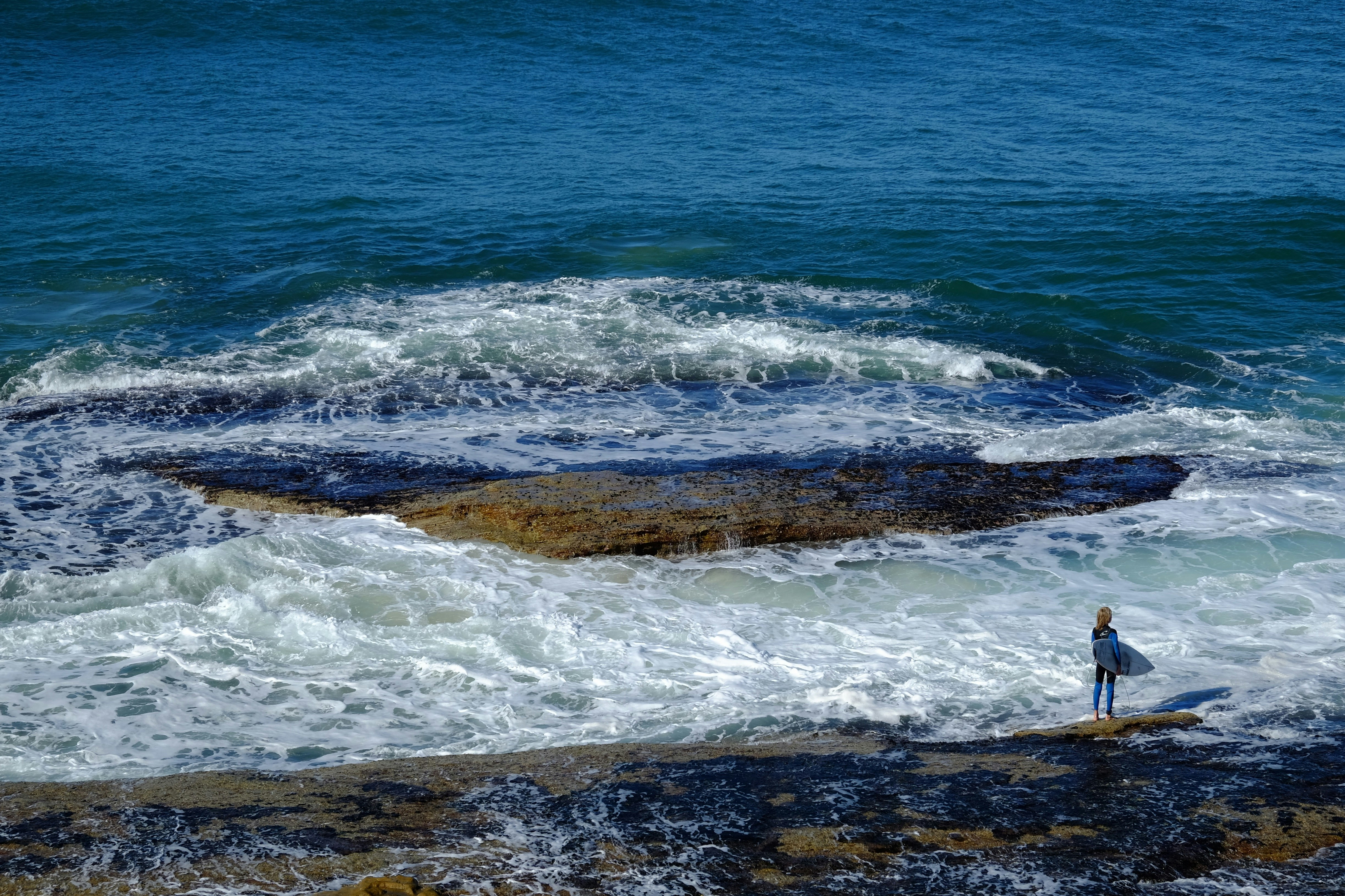 person about to surf on shore